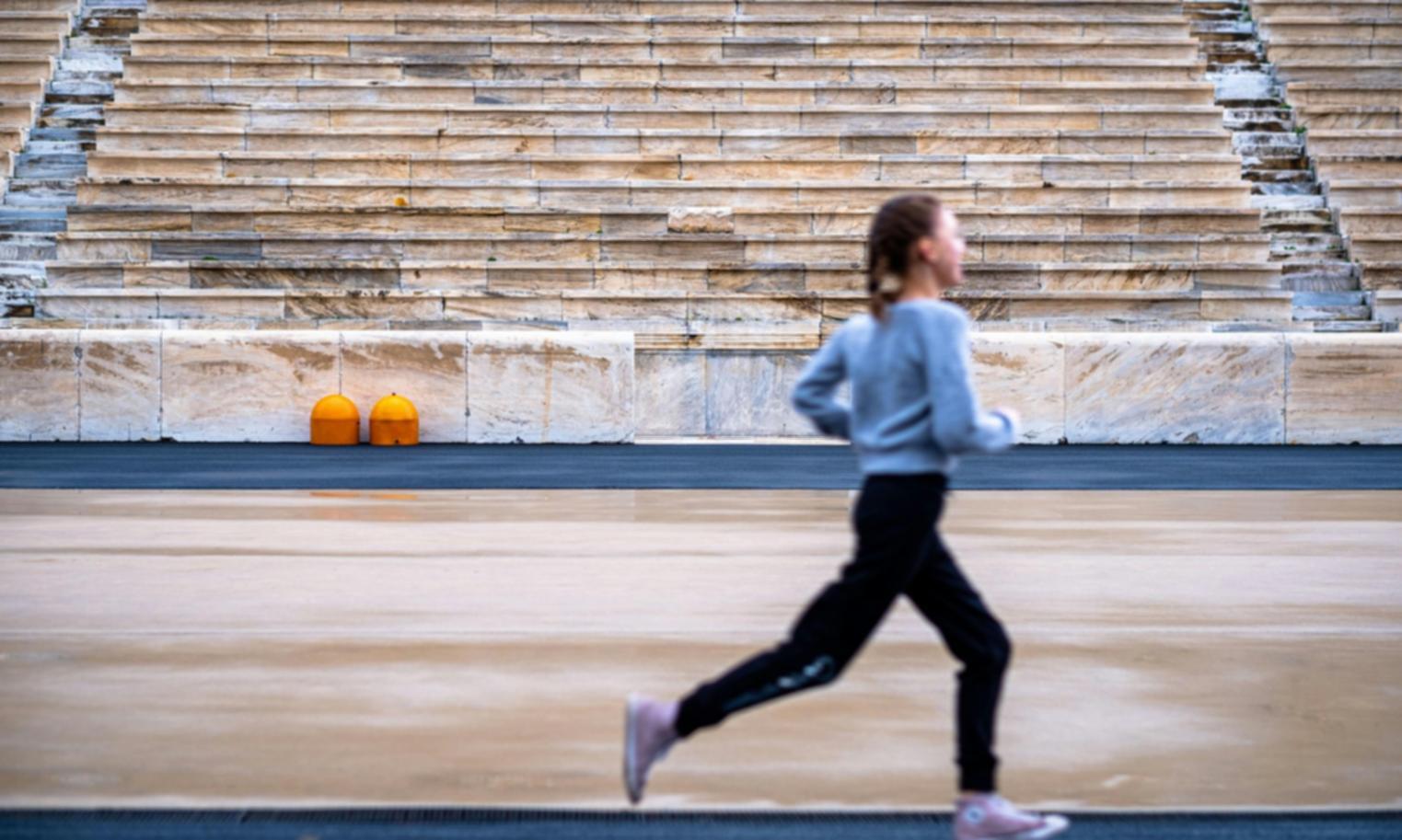 Athlete working through a structured CrossFit session with technique guidance
